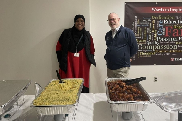 Khabir and Dr. Grand serve employees a delicious Iftar feast.
